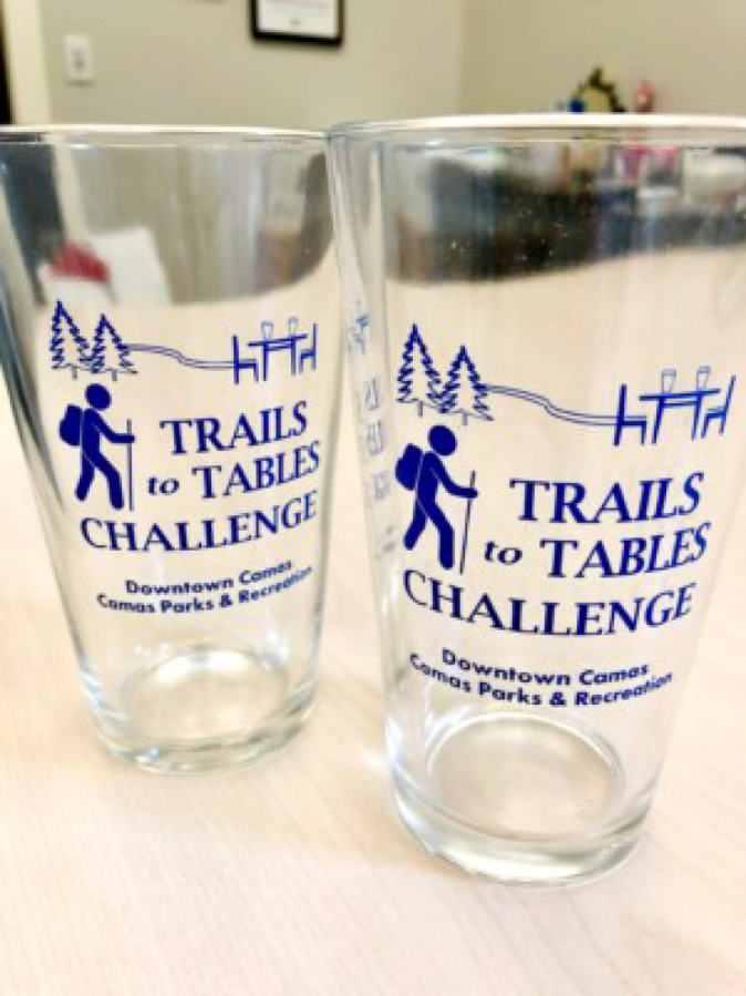 Papermaker Pride in downtown Camas will give these Trails to Tables glasses to people who complete the 2022 "Trails to Tables Challenge" by hiking five trails in Camas and dining at downtown Camas eateries. Participants must complete a Trails to Tables Challenge passport, available online and at local merchants, and bring it to Papermaker Pride by July 31, 2022, to receive a glass and be entered to win a $250 downtown Camas gift basket.