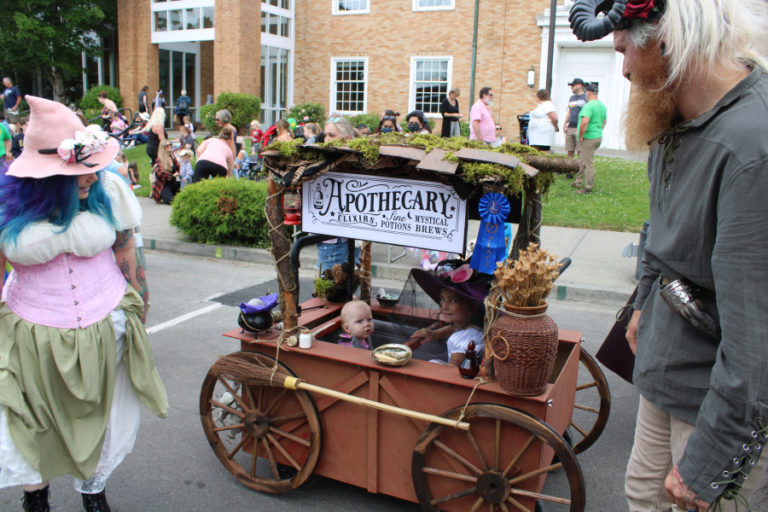 Miranda Straub (left) and Ian Straub, with their 10-month-old son, Cosmo, and neighbor, 6-year-old Lyralayne McGranaghan (in Apothecary cart), get ready for the Camas Days Kids Parade Friday, July 22, 2022.