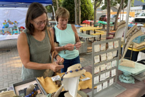 Event-goers look at pieces of art during the 2021 Washougal Art Festival. (Contributed photo courtesy of Rene Carroll)