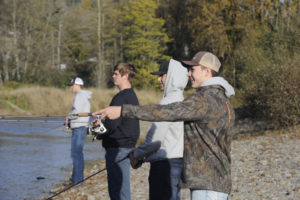Then-Washougal High School students (from left to right) Brevan Bea, Julien Jones, Jakob Davis and Dalton Payne fish along the Washougal River on Nov. 11, 2019. (Post-Record file photo)