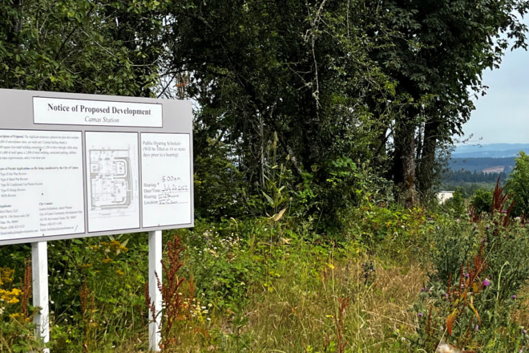 A &quot;Notice of Proposed Development&quot; sign showing a proposed gas station-convenience store complex known as &quot;Camas Station,&quot; sits on a vacant 2-acre parcel of land near the intersection of Northwest Brady Road and Northwest 16th Avenue on Monday, Aug. 1, 2022.