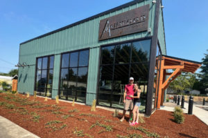 Washougal residents Tyler and Megan Davis stand in front of their new taproom/food-truck pod, Ashwood Taps and Trucks, in Washougal. Ashwood is set to open later this month. (Contributed photo courtesy Megan Davis)