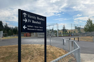 A sign points visitors toward the Camas High School junior varsity and varsity baseball fields on Monday, Aug. 8, 2022. (Kelly Moyer/Post-Record)