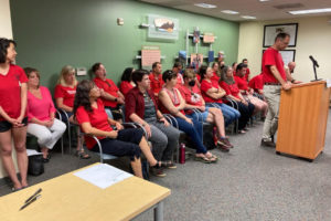 Washougal Association of Educators President James Bennett (right) speaks during a Washougal School Board meeting on Tuesday, Aug. 23, 2022. (Contributed photo courtesy Washougal Association of Educators)
