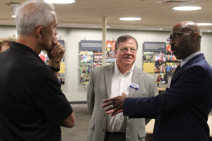 Camas city administrator applicant Bristol Ellington (right) talks to Camas Mayor Steve Hogan (center) and Camas City Councilmember Tim Hein (left) during an open house to meet the city's top two city administrator candidates on Tuesday, Sept. 13, 2022. (Kelly Moyer/Post-Record files)