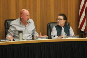 Washougal City Councilmember David Stuebe (left) speaks as Councilmember Janice Killion (right) looks on during a Washougal City Council meeting at Washougal City Hall in March 2022. (Doug Flanagan/Post-Record files)