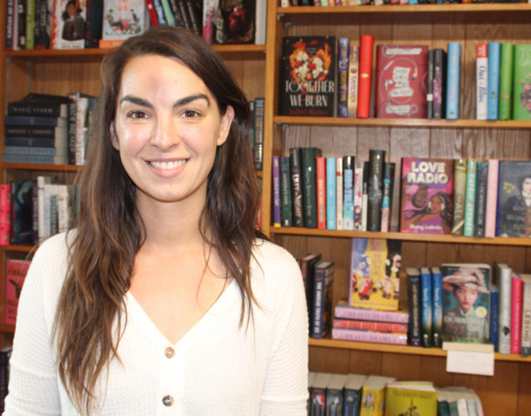 Melissa Peake, the owner of Bookish, shows her shop's selection of young adult books, on Thursday, Sept. 29, 2022. Bookish is located at 335 N.E. Fifth Ave., in downtown Camas.