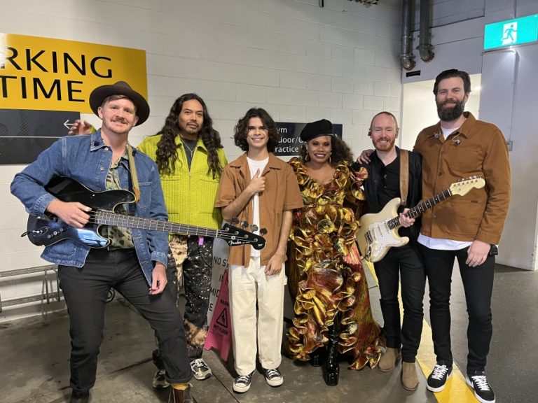 Contributed photo courtesy Jonny Aherne 
 Washougal resident Jonny Aherne (far left), the bass player for The Temper Trap, an Australian indie-pop band, poses for a photograph with his bandmates Dougy Mandagi (second from left), Toby Dundas (far right) and Joseph Greer (second from right), along with musicians Ngaiire (third from right) and Budjerah (center) at the Melbourne Cricket Ground Club in Melbourne, Australia, on Sept. 24. The Temper Trap performed a song at halftime of the Australian Rules Football Grand Final match.