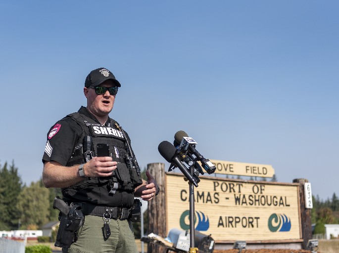Clark County Sheriff public information officer Chris Skidmore talks to media Monday, Sept. 17, 2022, during a briefing at Grove Field in Camas. The Nakia Creek Fire ballooned to more than 1,400 acres after dry and windy conditions on Sunday.  (Photo courtesy of Taylor Balkom/The Columbian)