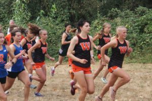 Washougal runners Sydnee Boothby (center) and Elle Thomas (right) finished third and fourth, respectively, at the 2A state cross country meet held Saturday, Nov. 5, 2022, in Pasco, Wash. (Doug Flanagan/Post-Record)