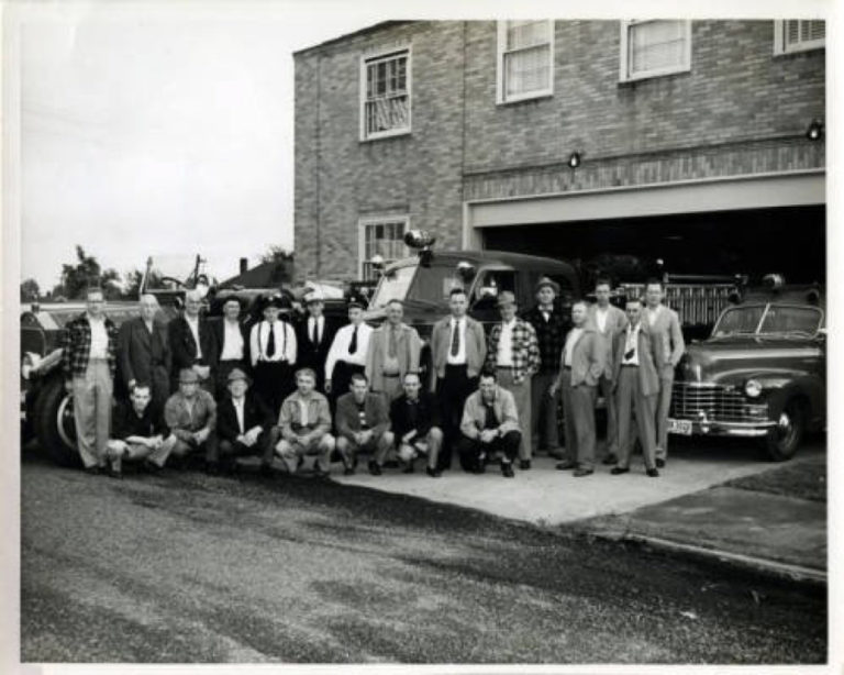 Camas Fire Department staff stand in front of their station in 1951. The fire station was part of Camas City Hall in 1951. This section of the Camas Public Library building now houses the children&#039;s library.