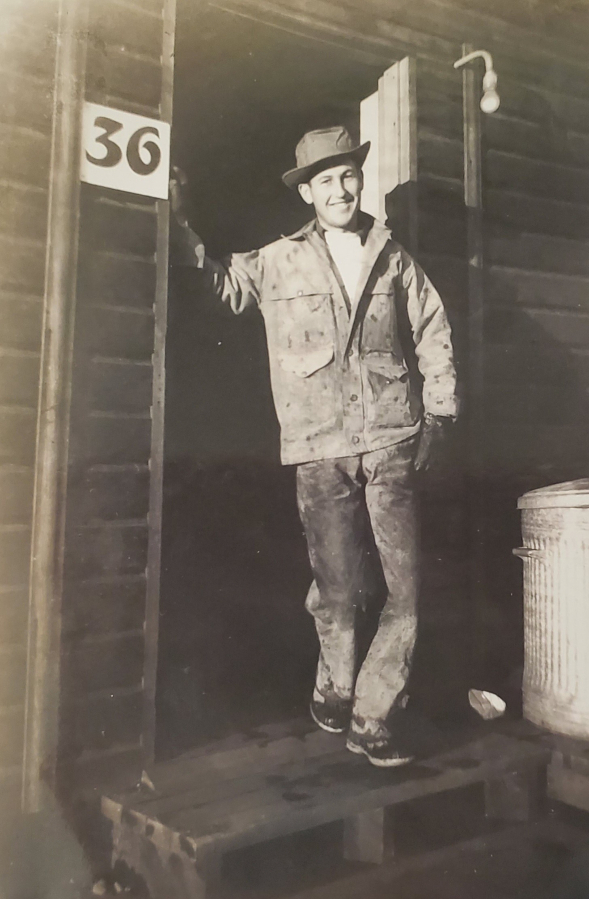 Ken Shold stands in front of his Army Corps of Engineers' cabin in Anchorage, Alaska, in 1942.
