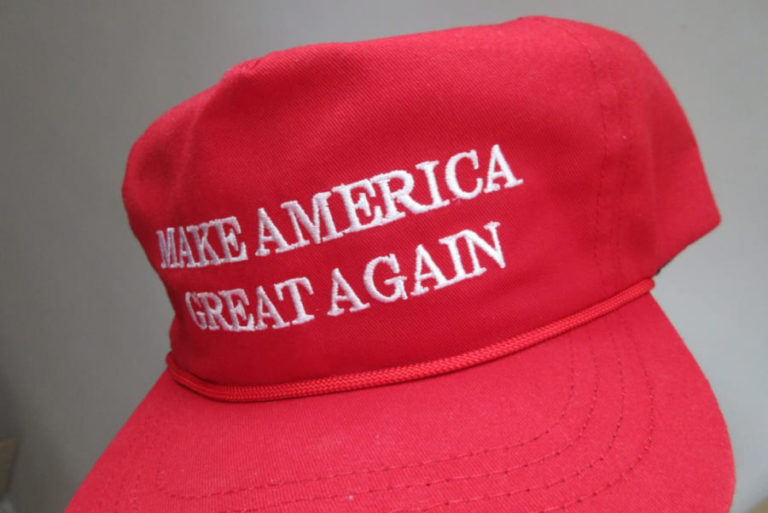 A pro-Donald Trump "Make America Great Again" hat is at the center of a Washougal man's recent $400,000 settlement with his former principal.