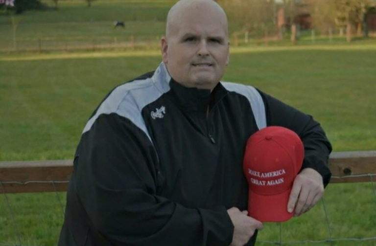 Eric Dodge, of Washougal, holds a "Make America Great Again" hat in a photo posted to Dodge's GoFundMe fundraiser.