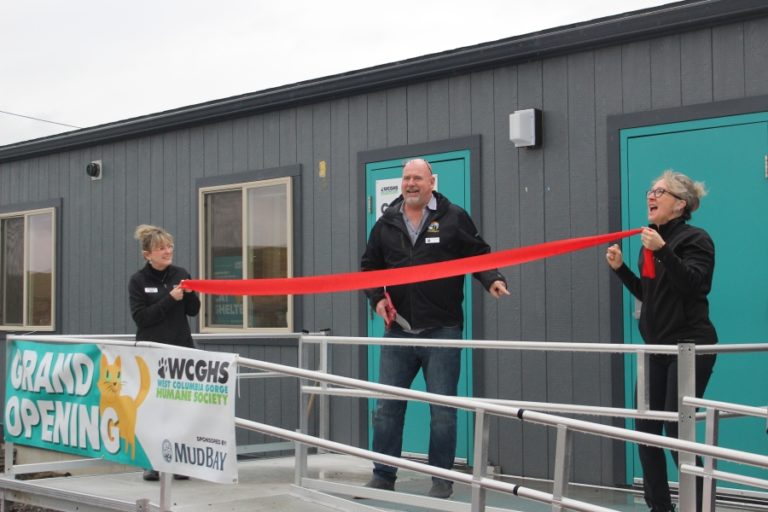 Doug Flanagan/Post-Record 
 Washougal Mayor David Stuebe (center) talks with West Columbia Gorge Humane Society executive director Micki Simeone (right) as Peggy DiPrima (left), the humane society&#039;s director of advancement, development, fundraising and events, looks on during a ribbon-cutting ceremony on Saturday, Jan. 21.