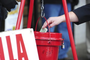 A person donates to the Salvation Army's 