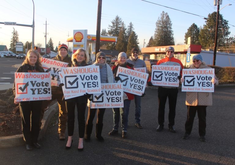 From left to right: Angela Hancock, Mark Castle, Washougal School District Superintendent Mary Templeton, Margaret Rice, Kori Kelly, Cory Chase, Aaron Hansen and Nichol Yung hold "Vote Yes!" signs, encouraging voters to pass the Washougal School District's replacement levies, at the corner of 32nd Streeet and Evergreen Way in Washougal, on Monday, Jan.