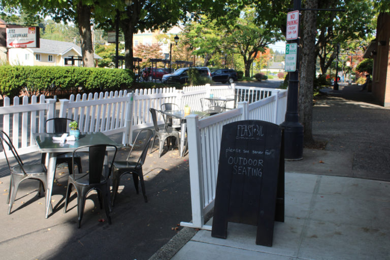 The original "parklet" outside Feast 316, which featured a white picket fence and tables spaced at least six feet apart, is pictured on Oct. 9, 2020.