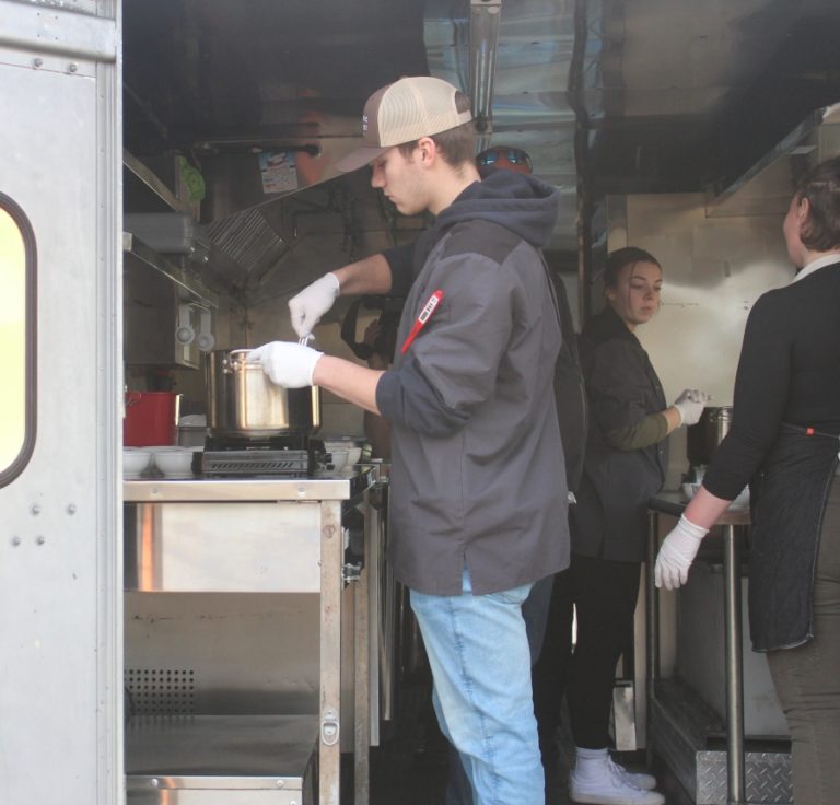 Doug Flanagan/Post-Record 
 Washougal High School culinary arts student Travis Gibson prepares chili on Thursday, Feb. 2, during a ribbon-cutting ceremony celebrating the opening of the district&#039;s Shoug Shack food-truck business at Washougal High School.
