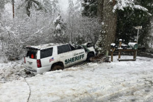 Clark County Sheriff's Deputy Drew Kennison was injured in a crash on Washougal River Road in Skamania County after the top of a snow-laden tree fell onto his vehicle, causing it to veer off the roadway and into another tree, on Wednesday, Feb. 22, 2023. (Contributed photo courtesy of Clark County Sheriff's Office) 