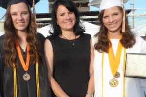 Washougal resident Laurie Johnson (center) and her daughters, Kaitlyn (left) and Kari, attend Washougal High School's graduation ceremony in June 2013. (Contributed photo courtesy of Laurie Johnson)