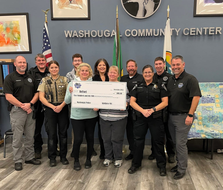 Contributed photo courtesy of ReFuel Washougal 
 ReFuel Washougal recently received a &quot;kindness citation&quot; and $500 from Kindness 911, a Clark Count-based nonprofit organization. Ann Stevens (fifth from left) recently took over as ReFuel&#039;s board chair, replacing Robert Barber.