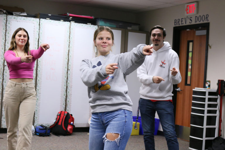 Washougal High School students Sam Jackson (left), Natalie Schoenborn (center) and Zach Bobeck practice their performance for the school&#039;s American Sign Language Showcase earlier this year.