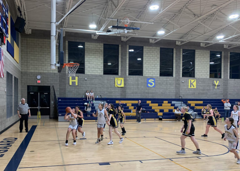 The Jemtegaard Middle School girls basketball team plays a game in December 2022.