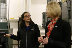 Screenshot by Doug Flanagan/Post-Record 
 Washougal School District facilities, maintenance and grounds supervisor Jessica Beehner (left) talks with Washougal School District Superintendent Mary Templeton in Washougal High School's boiler room earlier this year.