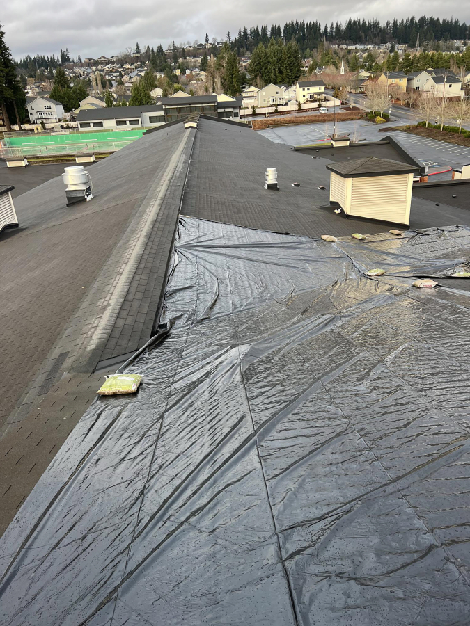 Contributed photo courtesy Washougal School District 
 Tarps cover a portion of Washougal High School&#039;s roof in January.