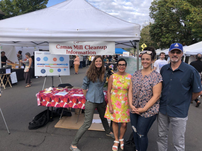 Members of the Citizen Advisory Group working to inform the public about an ongoing environmental cleanup process at the Georgia-Pacific paper mill in Camas work at a CAG booth at the Camas Farmer&#039;s Market in September 2022.