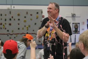 Mark Bauer, Gause Elementary School's physical education teacher, laughs after being covered with "silly string" on Tuesday, March 28, 2023. (Doug Flanagan/Post-Record)