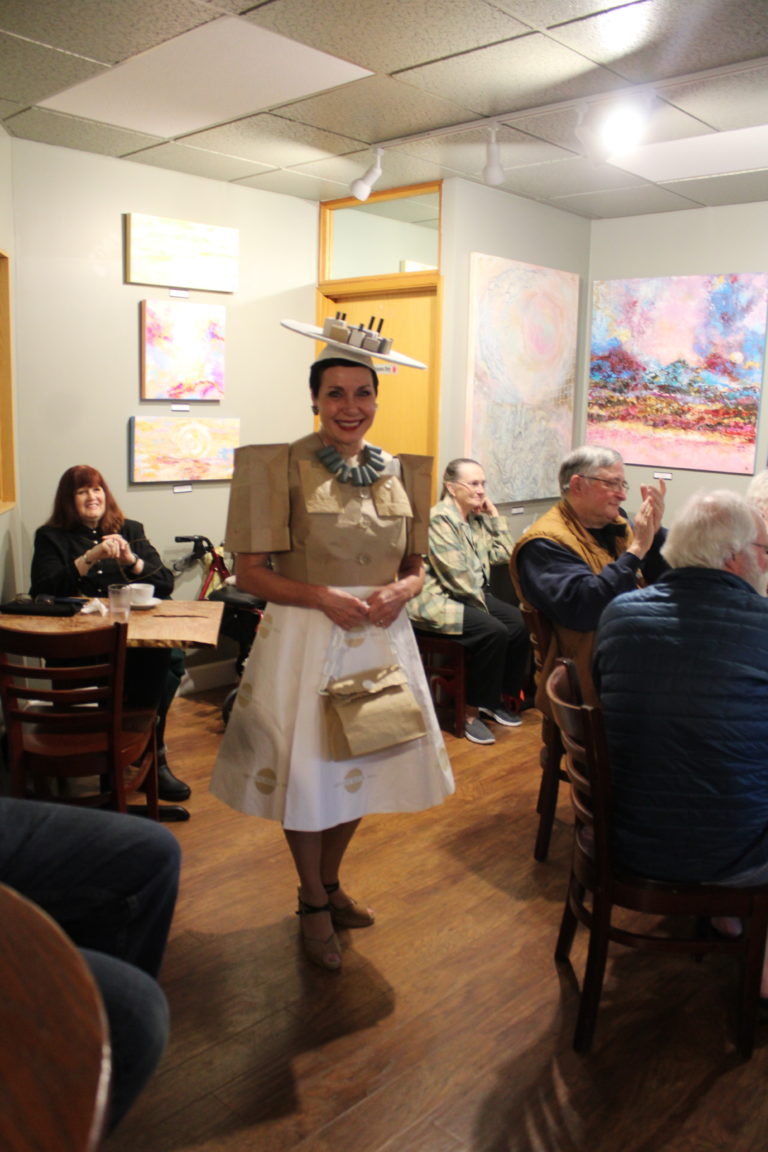 Downtown Camas Association Board member and past DCA Board president Caroline Mercury wears a paper dress to celebrate Camas' history as a paper mill town, during the DCA's "Spring into History" event, held throughout downtown Camas on Friday, April 7, 2023. (Kelly Moyer/Post-Record)