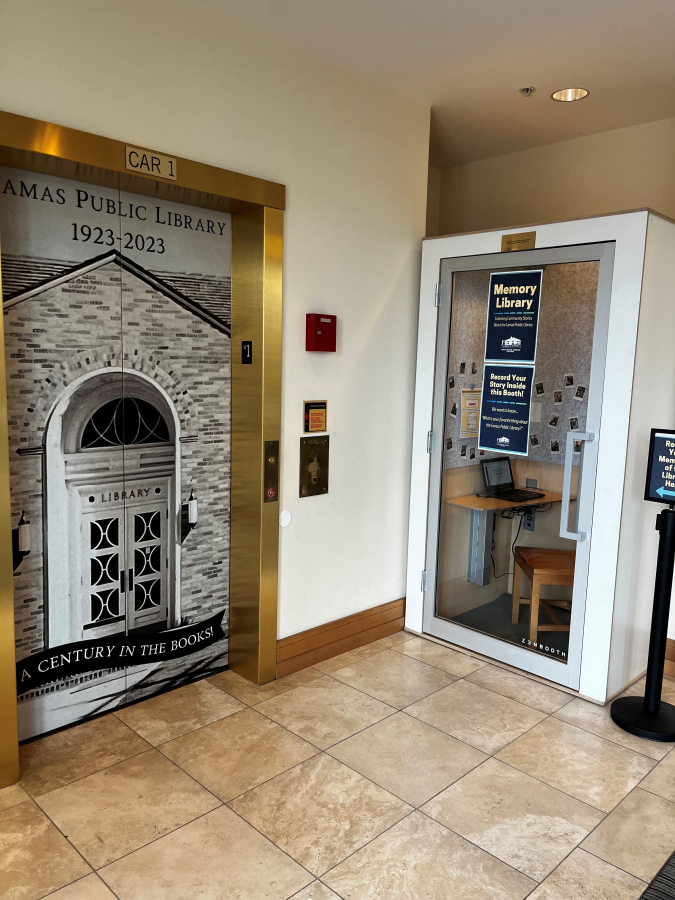 The Northeast Fourth Avenue lobby of the Camas Public Library features "A Century in the Books" artwork, celebrating the library's 100th anniversary, on the elevator doors and a "memory library" for Camas residents to share their own memories of the library and town, on Friday, April 7, 2023. (Kelly Moyer/Post-Record)