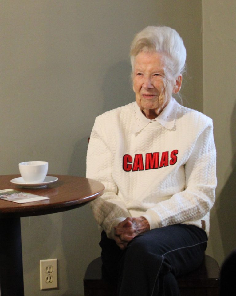 Camas historian Virginia Warren has a cup of tea inside Caffe Piccolo in downtown Camas during the April 7 First Friday "Spring into History" event. Warren amused the crowd inside the cafe with stories from her childhood in Camas. (Kelly Moyer/Post-Record)