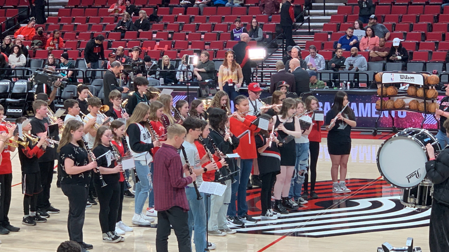 Members of the Jemtegaard Middle School wind ensemble perform a song at the Moda Center in Portland before the start of the Portland Trail Blazers' game against the Sacramento Kings on Wednesday, March 29, 2023.