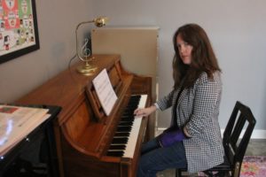 Valerie Ross performs a song at her new downtown Washougal studio on Tuesday, April 4, 2023. (Doug Flanagan/Post-Record)