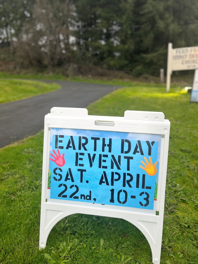 An Earth Day event sign sits in front of the  historic Fern Prairie United Methodist Church north of Camas on Monday, April 17, 2023.