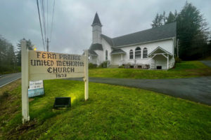 Lights illuminate a sign in front of the historic Fern Prairie United Methodist Church on Monday, April 17, 2023. The church, located off Northeast Brunner Road, north of Camas, will celebrate its 150th anniversary throughout 2023. (Photos by Kelly Moyer/Post-Record)