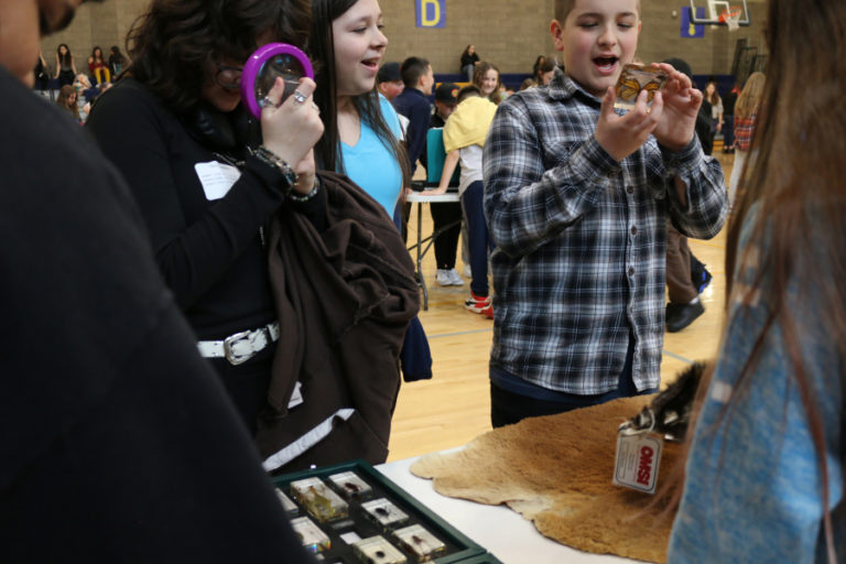 Jemtegaard Middle School sixth-grade students Marina Kuya (left) and Layton Chiccino participate in Oregon Museum of Science and Industry-provided activities during the school's Career Day event on Wednesday, April 19, 2023.