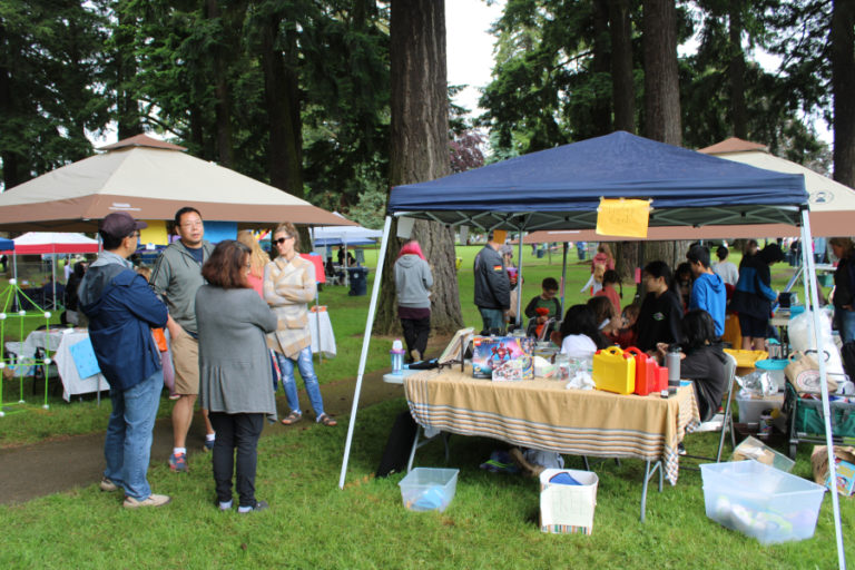A crowd gathers at the children's flea market during the Camtown Youth Festival on Saturday, June 4, 2022.