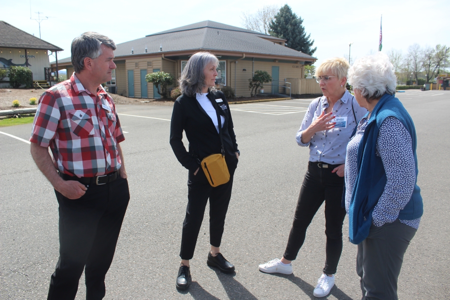 Roma Toft (third from left), of Poland, talks with Port of Camas-Washougal commissioners John Spencer (far left) and Cassi Marshall (second from left), and  Councilwoman Molly Coston April 26, 2023, near the Port's headquarters.
