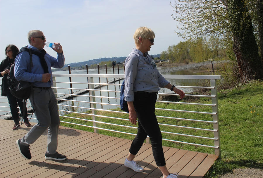 Doug Flanagan/Post-Record 
 Roma Toft (right) walks off the Steamboat Landing dock, on her way to the Pendleton Woolen Mill factory in Washougal, on Wednesday, April 26.