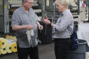 Doug Flanagan/Post-Record 
 Zielonki, Poland resident Roma Toft (right) chats with Rolan Snider, Pendleton Woolen Mills' vice president of textile manufacturing, during a factory tourr on Wednesday, April 26. (Photos by Doug Flanagan/Post-Record)