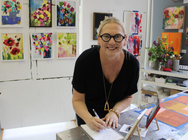 Camas artist Heidi Curley greets visitors during an open house for the new 411 Art Collective, located inside Lara Blair's photography studio at 411 N.E. Dallas St. on Friday, May 5, 2023.