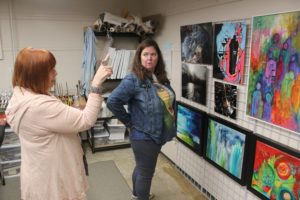 Elizabeth Nye (left) discusses her work with artist Angela Swanson (right) at the new Adret Artist Collective shared art studio in Washougal on Thursday, May 4, 2023.
