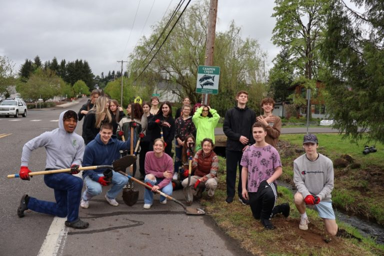 Contributed photo courtesy Janet Grove 
 Washougal High School Advanced Placement environmental science students pose for a photo while planting native plants alongside Campen Creek in Washougal on Friday, May 5.
