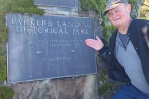 Washougal resident David Parker stands next to the Parker's Landing Historical Park sign in Washougal in early 2023. The Washougal High School Band will perform Parker's original song, 