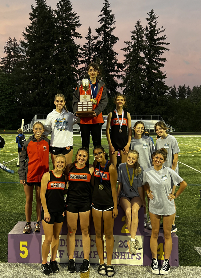 Washougal girls track and field members gather May 27, 2023, after winning the 2A District 4 meet.