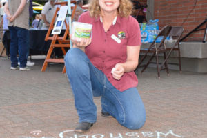 Washougal artist Suzanne Grover displays her love of Washougal with a chalk drawing during the 2018 Washougal Art Festival. Grover died May 22, 2023, at the age of 53, two years after being diagnosed with stage-four lung cancer. (Contributed photo courtesy of Rene Carroll)